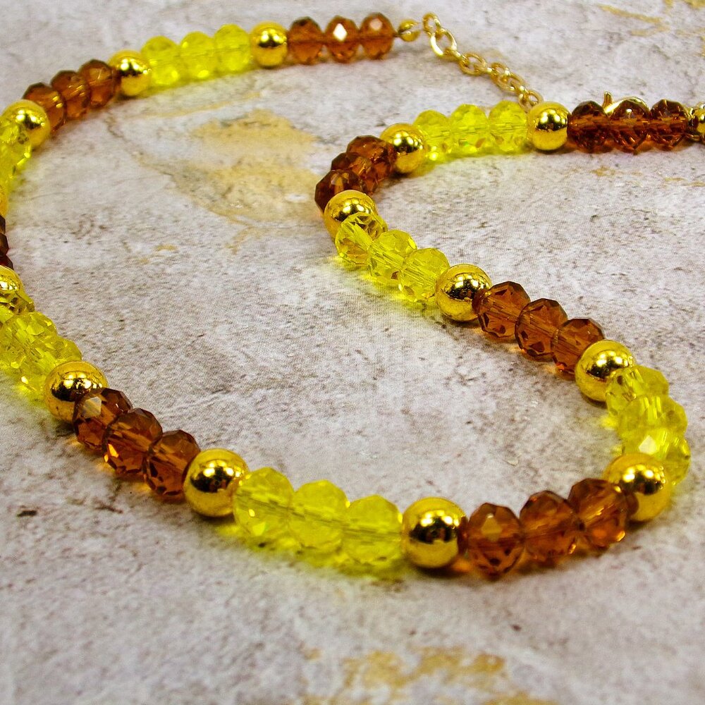 Yellow and brown all glass bead necklace mixed with polished gold beads.